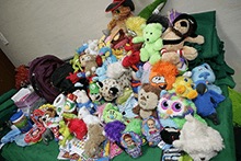 A large pile of donated soft toys for children after surgery